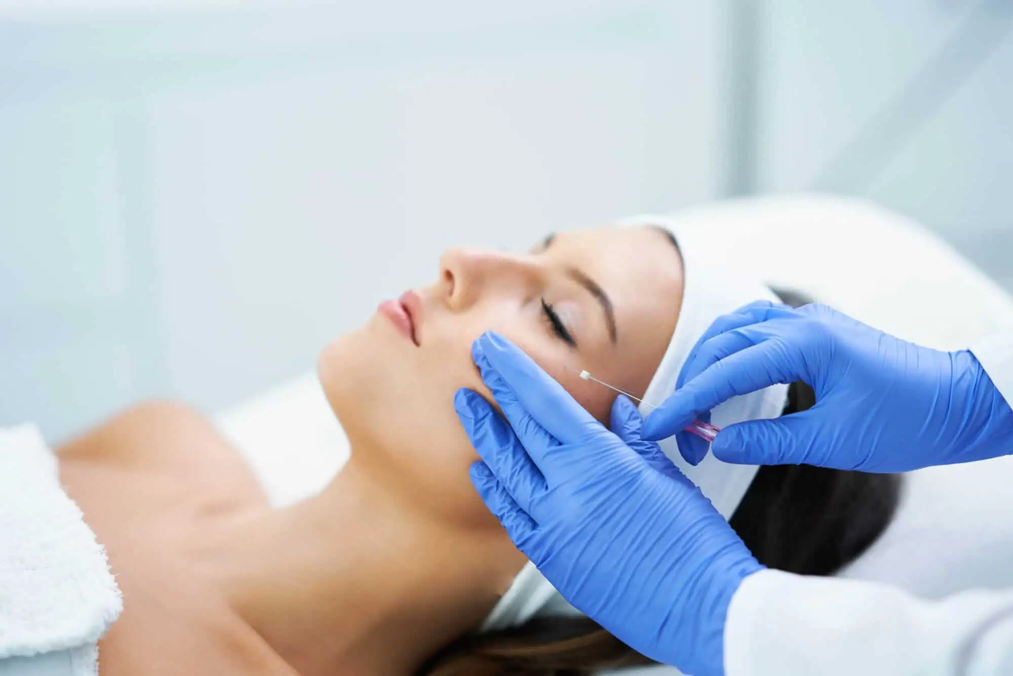 a woman receiving a botox injection